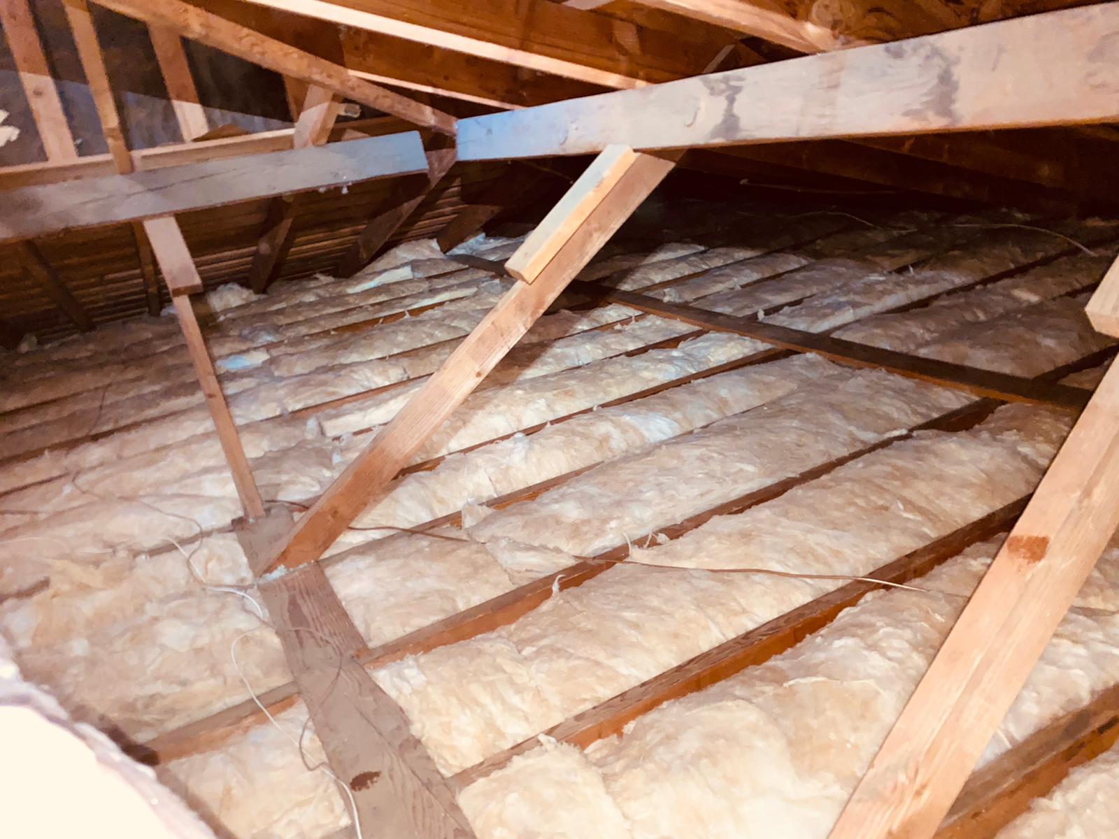 Fiberglass batt insulation installed in an attic
